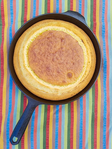 Sweet cornbread in cast iron skillet by Crisbee for cornbread recipe