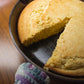 Cornbread piece taken from freshly Crisbee-seasoned cast iron skillet