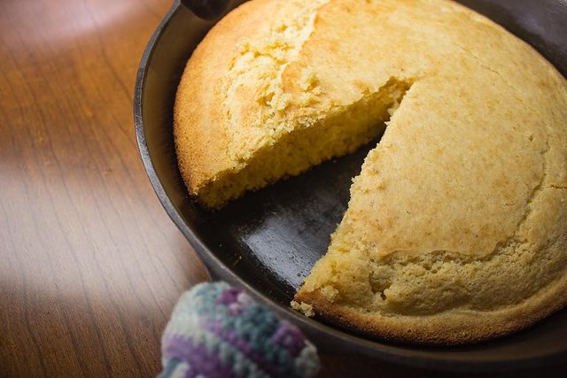 Cornbread piece taken from freshly Crisbee-seasoned cast iron skillet